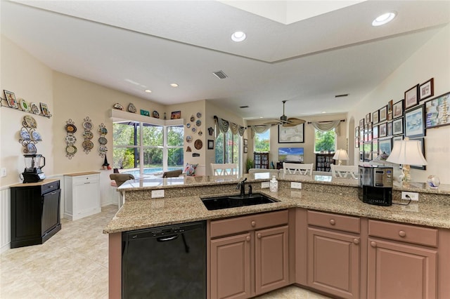 8136 Snowy Egret Pl, Bradenton, FL 34202 - kitchen with black dishwasher, open floor plan, ceiling fan, light stone countertops, and recessed lighting