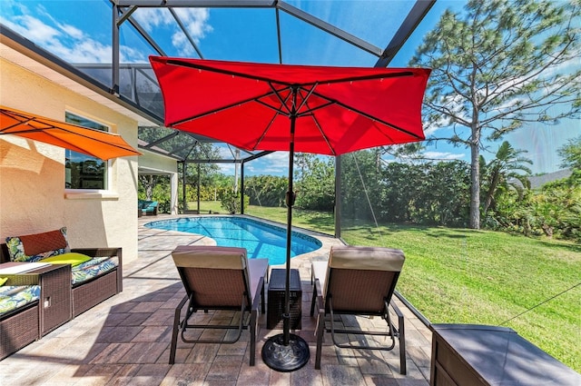 8136 Snowy Egret Pl, Bradenton, FL 34202 - swimming pool with a lawn, a patio area, and glass enclosure