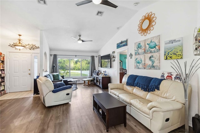 18033 Edgewater Dr, Port Charlotte, FL 33948 - living area with visible vents, high vaulted ceiling, wood finished floors, and a ceiling fan