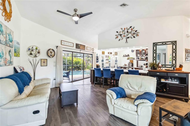 18033 Edgewater Dr, Port Charlotte, FL 33948 - living area with visible vents, vaulted ceiling, a ceiling fan, and wood finished floors