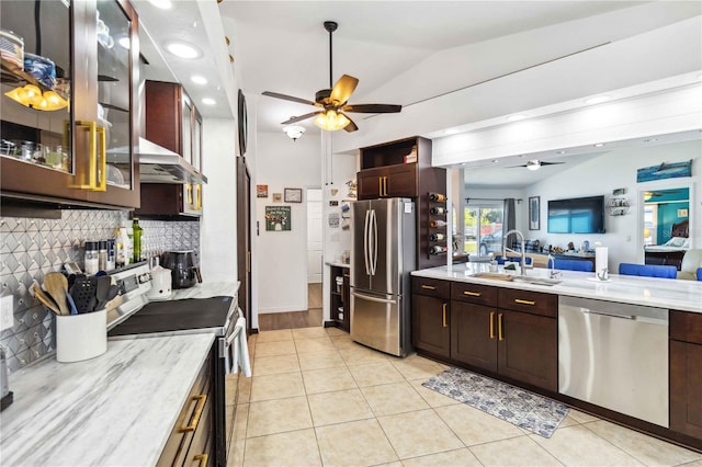 18033 Edgewater Dr, Port Charlotte, FL 33948 - kitchen with lofted ceiling, ceiling fan, a sink, and stainless steel appliances