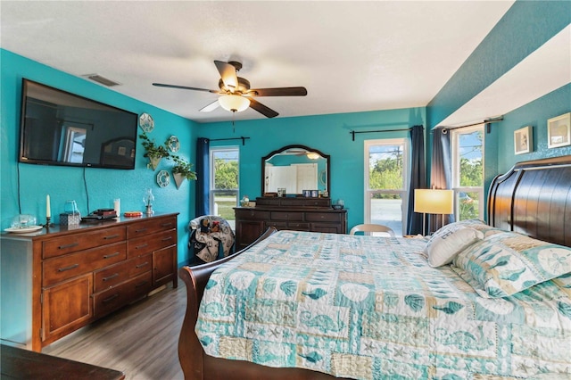 18033 Edgewater Dr, Port Charlotte, FL 33948 - bedroom featuring visible vents, wood finished floors, and a ceiling fan