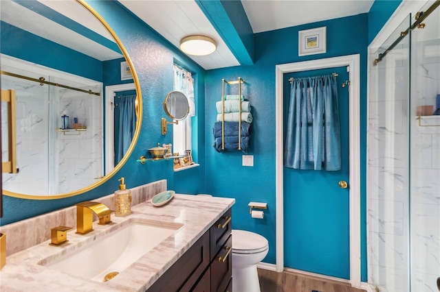 18033 Edgewater Dr, Port Charlotte, FL 33948 - full bathroom featuring baseboards, a marble finish shower, toilet, wood finished floors, and vanity