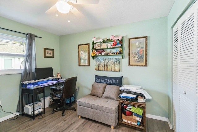 18033 Edgewater Dr, Port Charlotte, FL 33948 - home office featuring a ceiling fan, baseboards, and wood finished floors