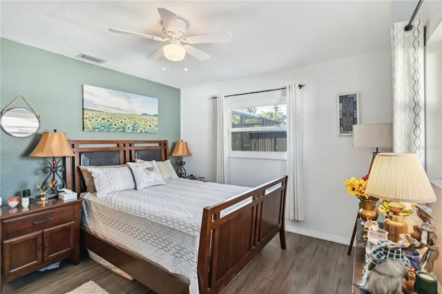 18033 Edgewater Dr, Port Charlotte, FL 33948 - bedroom featuring baseboards, visible vents, wood finished floors, and a ceiling fan