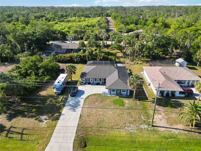 18033 Edgewater Dr, Port Charlotte, FL 33948 - aerial view with a wooded view