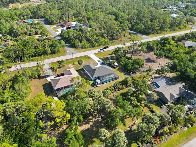 18033 Edgewater Dr, Port Charlotte, FL 33948 - aerial view with a forest view