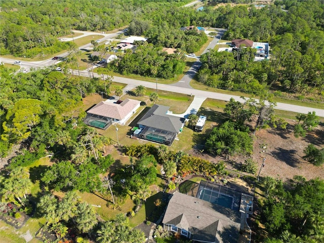 18033 Edgewater Dr, Port Charlotte, FL 33948 - birds eye view of property with a wooded view