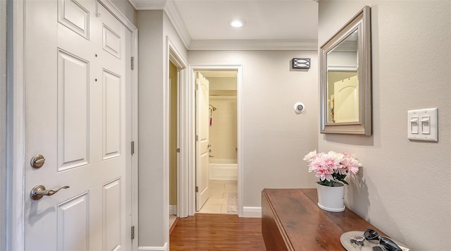 hall with crown molding, baseboards, recessed lighting, and dark wood-type flooring