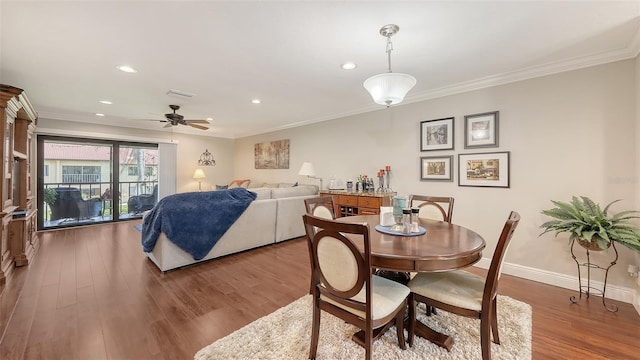 dining area with crown molding, wood finished floors, a ceiling fan, and recessed lighting