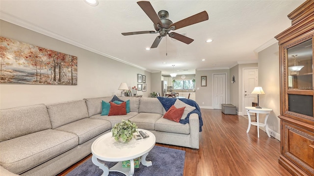 living area featuring recessed lighting, baseboards, a ceiling fan, and wood finished floors