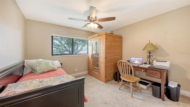 bedroom with baseboards, a ceiling fan, and light colored carpet