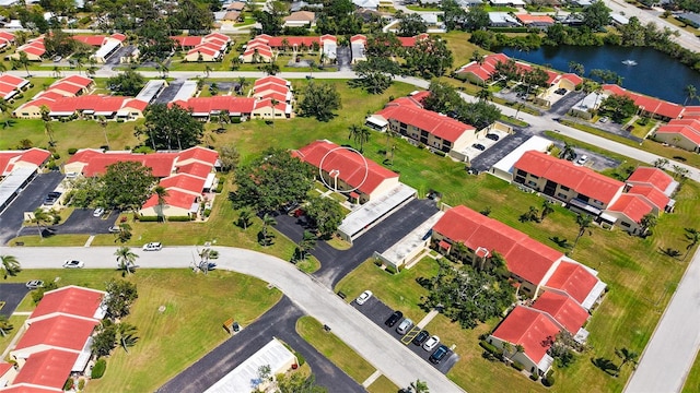 aerial view with a residential view and a water view