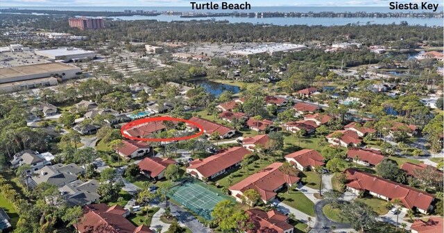 aerial view with a water view and a residential view