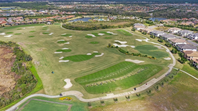 aerial view with a water view, a residential view, and view of golf course
