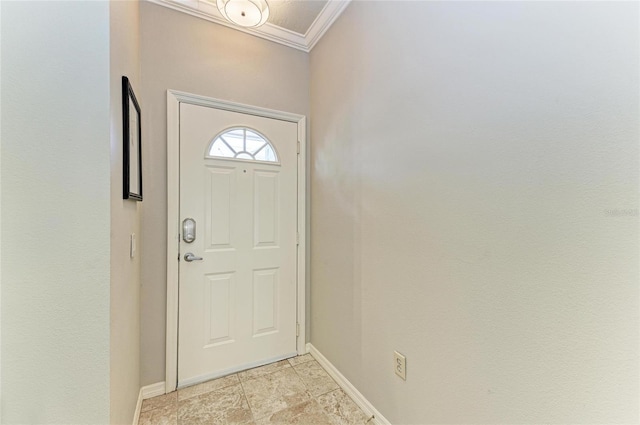 doorway featuring crown molding and baseboards