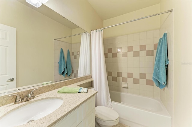 full bath featuring shower / bath combo with shower curtain, vanity, and toilet