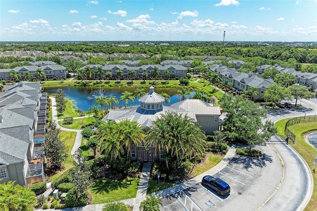 birds eye view of property with a residential view and a water view