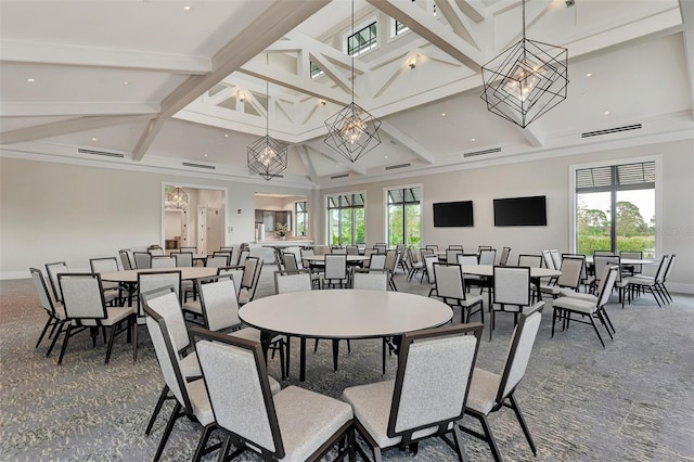 dining area with visible vents, beamed ceiling, baseboards, and a towering ceiling