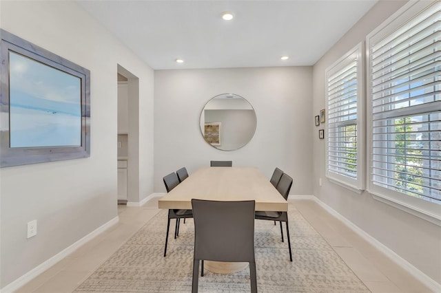 dining room with recessed lighting, light tile patterned floors, and baseboards