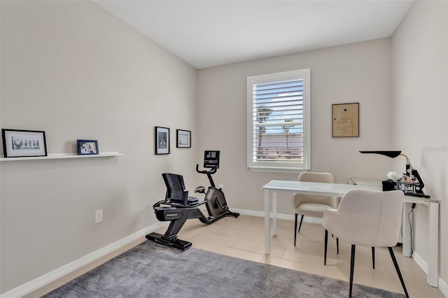 office area with light tile patterned floors and baseboards