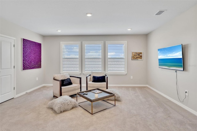 sitting room with recessed lighting, carpet flooring, visible vents, and baseboards