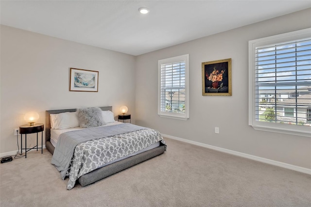 carpeted bedroom with baseboards