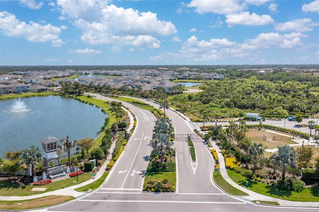 birds eye view of property featuring a water view and a residential view