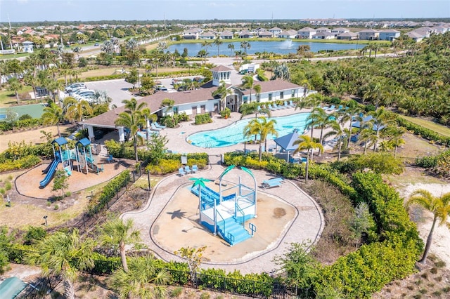drone / aerial view featuring a residential view and a water view