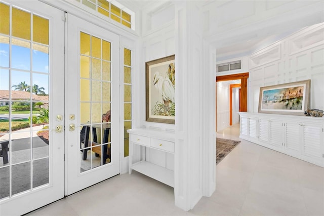 2196 Muskogee Trl, Nokomis, FL 34275 - entryway with french doors, tile patterned flooring, and a decorative wall