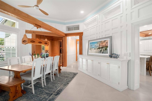 2196 Muskogee Trl, Nokomis, FL 34275 - dining space featuring a decorative wall, ceiling fan, and ornamental molding