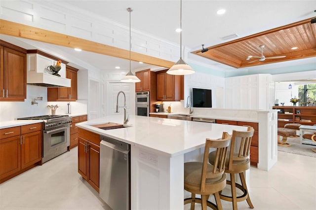 2196 Muskogee Trl, Nokomis, FL 34275 - kitchen with stainless steel appliances, brown cabinetry, crown molding, a sink, and light countertops