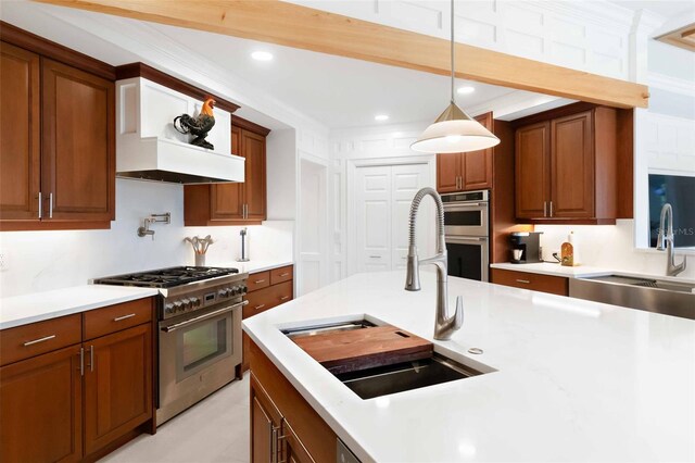 2196 Muskogee Trl, Nokomis, FL 34275 - kitchen with stainless steel appliances, a sink, light countertops, brown cabinets, and recessed lighting