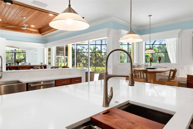 2196 Muskogee Trl, Nokomis, FL 34275 - kitchen featuring stainless steel dishwasher, a sink, pendant lighting, ornamental molding, and wooden ceiling