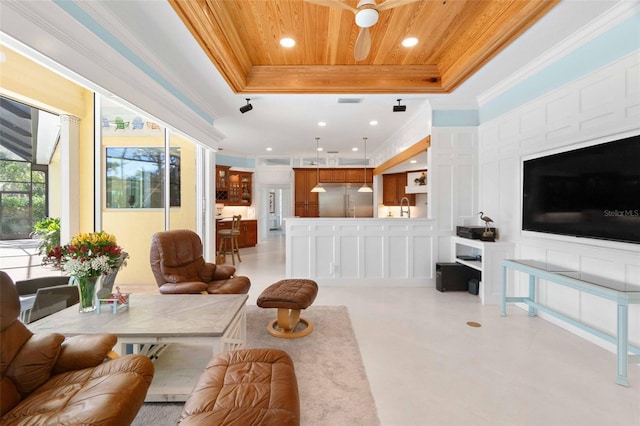2196 Muskogee Trl, Nokomis, FL 34275 - living room featuring a raised ceiling, ornamental molding, wooden ceiling, ceiling fan, and recessed lighting