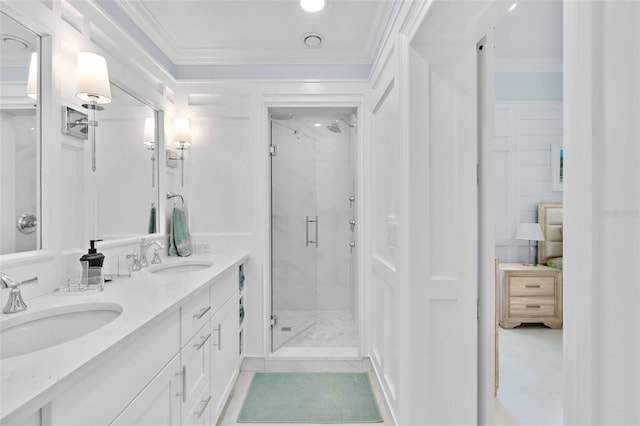 2196 Muskogee Trl, Nokomis, FL 34275 - bathroom featuring a stall shower, ornamental molding, and double vanity
