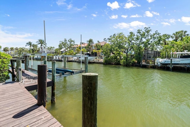 dock area with a water view and boat lift