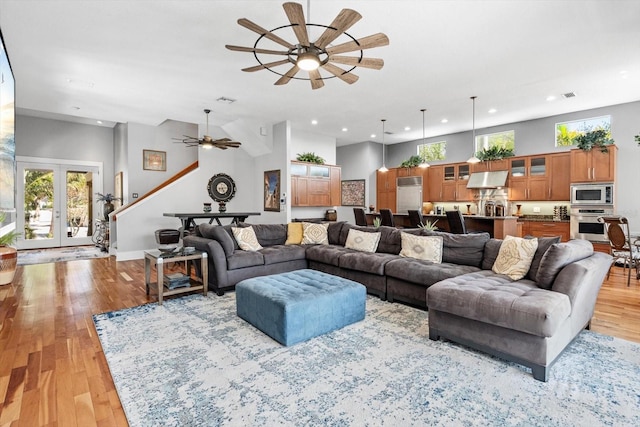 living area featuring a healthy amount of sunlight, ceiling fan, and recessed lighting