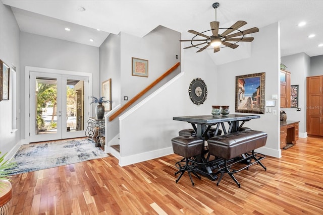 entryway with light wood-style floors, baseboards, and ceiling fan