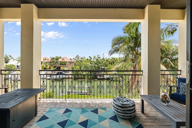 balcony featuring a water view