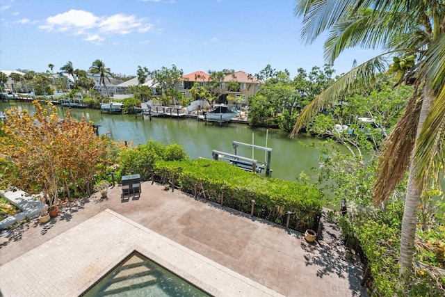 view of dock featuring a water view and a residential view