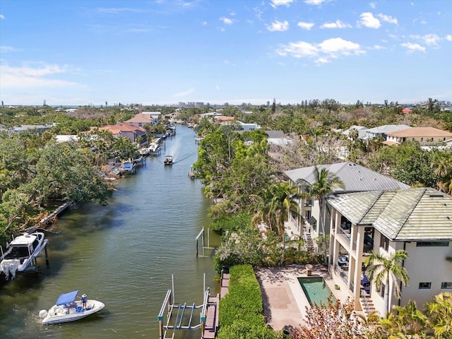 drone / aerial view with a residential view and a water view