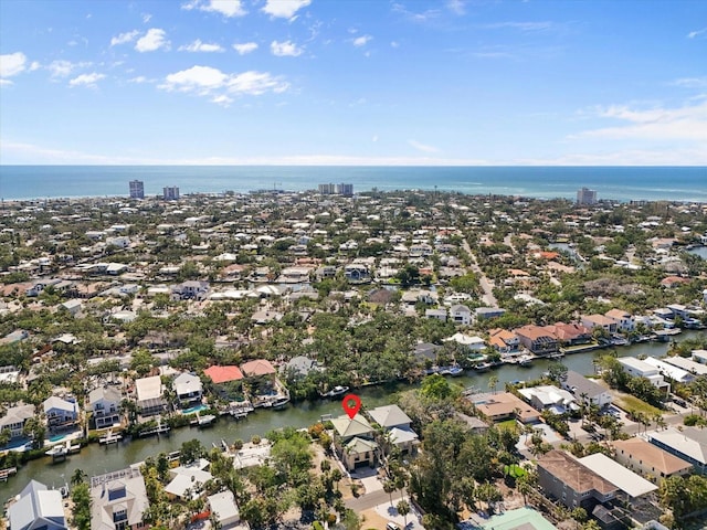 drone / aerial view with a water view and a residential view