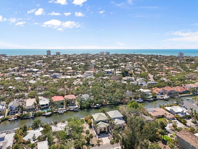 bird's eye view featuring a residential view and a water view