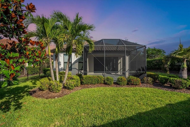 4704 Stafford Ct, Palmetto, FL 34221 - back of property at dusk with a lanai and stucco siding