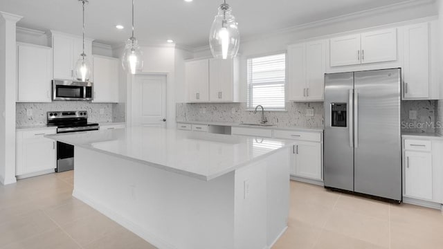 1599 Laurel Brook Ln, Port Charlotte, FL 33953 - kitchen featuring appliances with stainless steel finishes, a sink, crown molding, tasteful backsplash, and a center island