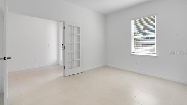 1599 Laurel Brook Ln, Port Charlotte, FL 33953 - spare room with light tile patterned floors and baseboards