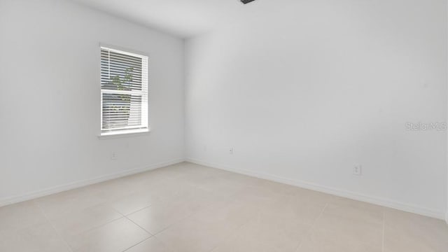 1599 Laurel Brook Ln, Port Charlotte, FL 33953 - spare room with baseboards and light tile patterned flooring