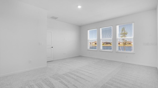1599 Laurel Brook Ln, Port Charlotte, FL 33953 - empty room featuring light carpet, baseboards, and recessed lighting