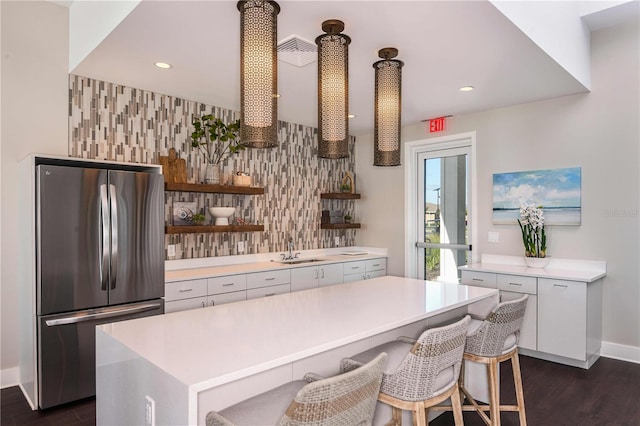 1599 Laurel Brook Ln, Port Charlotte, FL 33953 - kitchen with freestanding refrigerator, a sink, dark wood-type flooring, light countertops, and open shelves